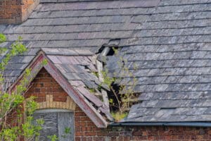 Roof replacement needed for Damaged Slate Roof Tiles On A Pitched Roof