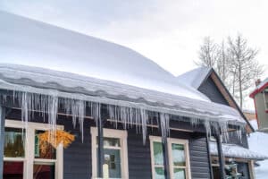 Roof Maintenance snow removal needed for home with snow on roof