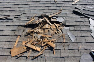 Roof repair construction site. Removal of old roof, replacement with new shingles, equipment and repair. Roofs are a very important part of all housing projects around the world.