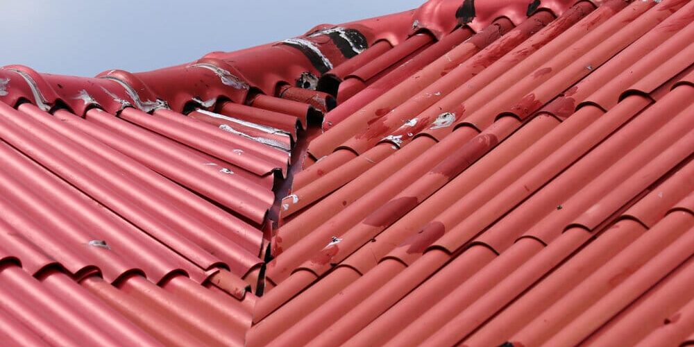 Roofing Problems. Red Roof Was Damaged By bad weather. Roofing Problems. Red Roof Was Damaged By bad weather.