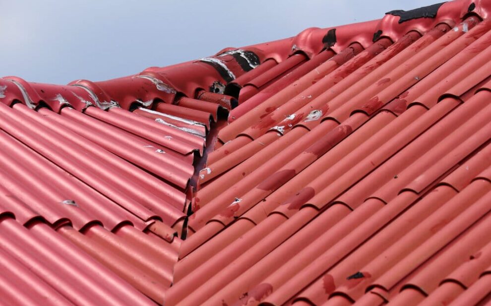 Roofing Problems. Red Roof Was Damaged By bad weather.