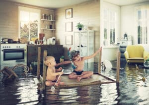 Roof Leak Repair. Kids Play On The Table while Flooding In The Kitchen.