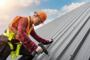 Roof Maintenance. Roofer performing roof maintenance.