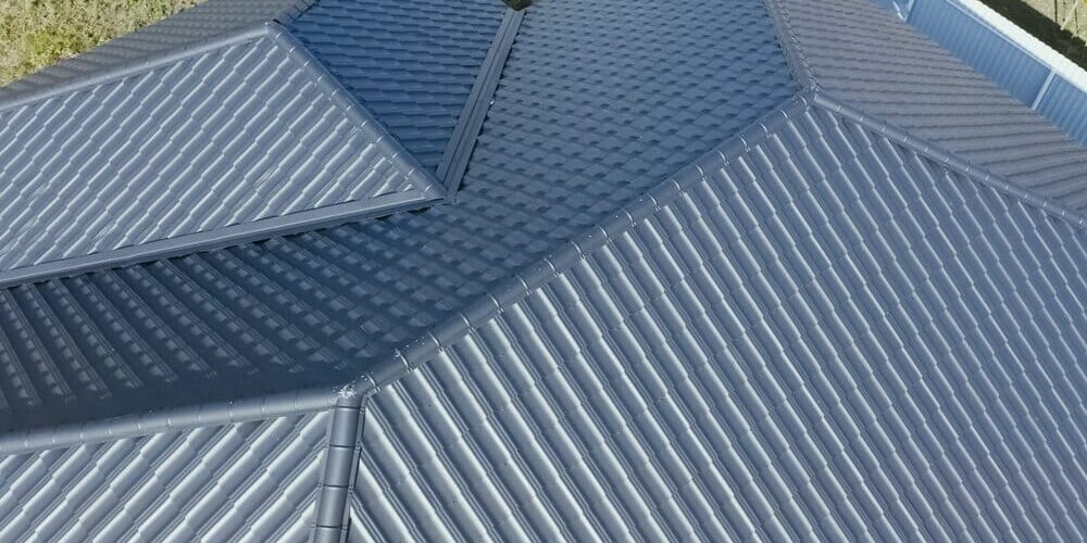 Metal Shingle Roof. House With A Gray Metal Roof. Metal Shingle Roof. House With A Gray Metal Roof.