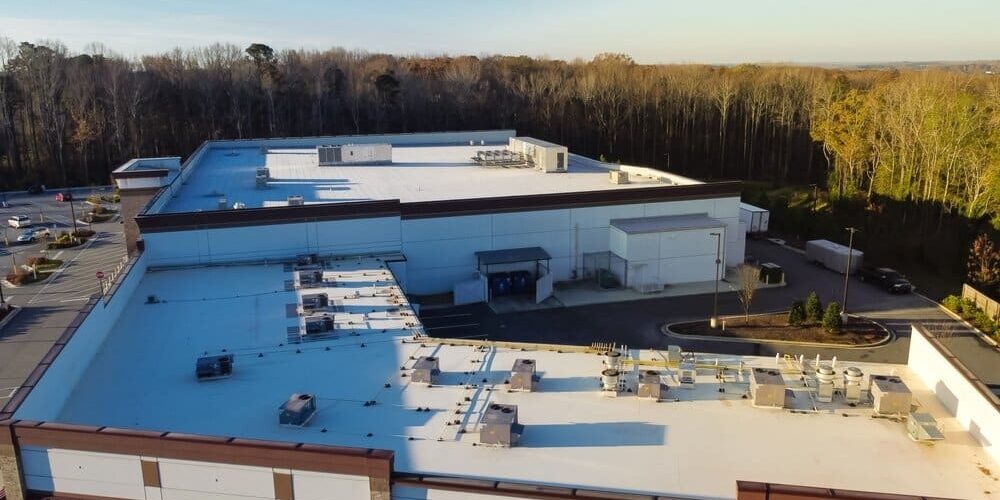 commercial roofing. Large Grocery Store And Strip Mall With Rooftop Units. commercial roofing. Large Grocery Store And Strip Mall With Rooftop Units.