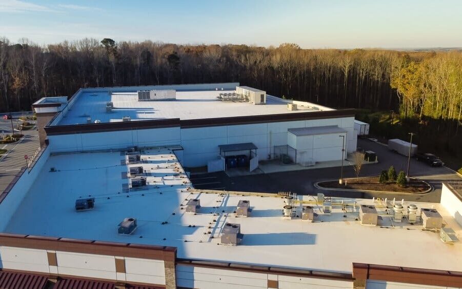 commercial roofing. Large Grocery Store And Strip Mall With Rooftop Units.