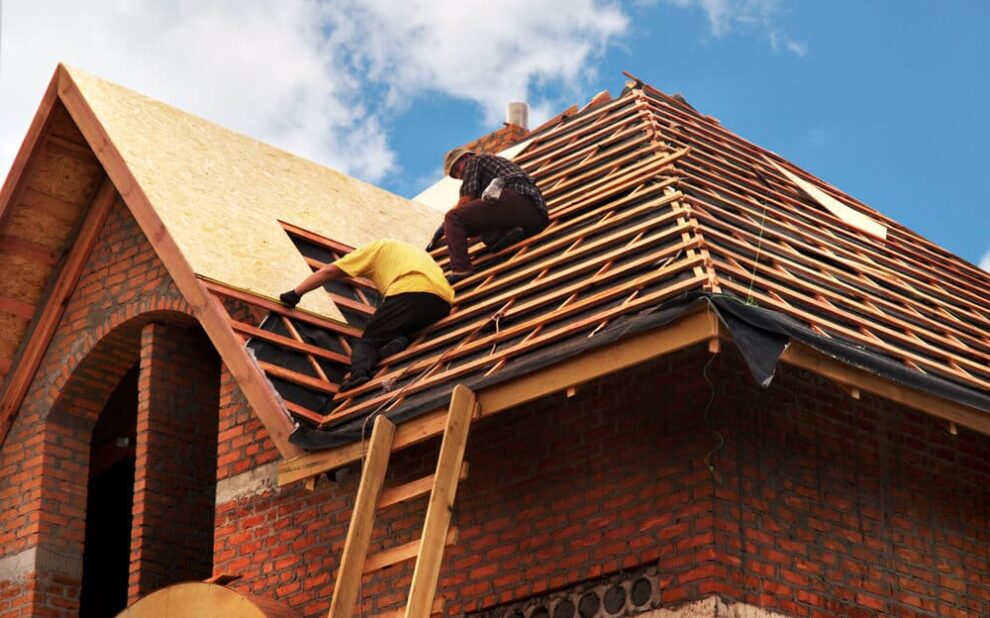 Roof Contractors. Roofing Contractors Installing House Roof Board For Asphalt Shingles Roofing.