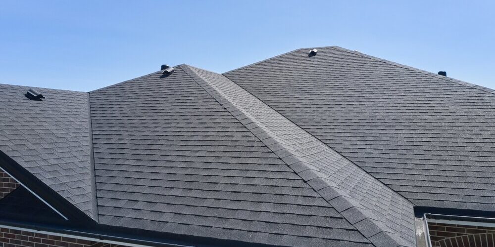 Godfrey Roofing. Roof Of The House Made Of Bitumen Roof Shingles. Godfrey Roofing. Roof Of The House Made Of Bitumen Roof Shingles.