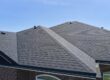 Godfrey Roofing. Roof Of The House Made Of Bitumen Roof Shingles.