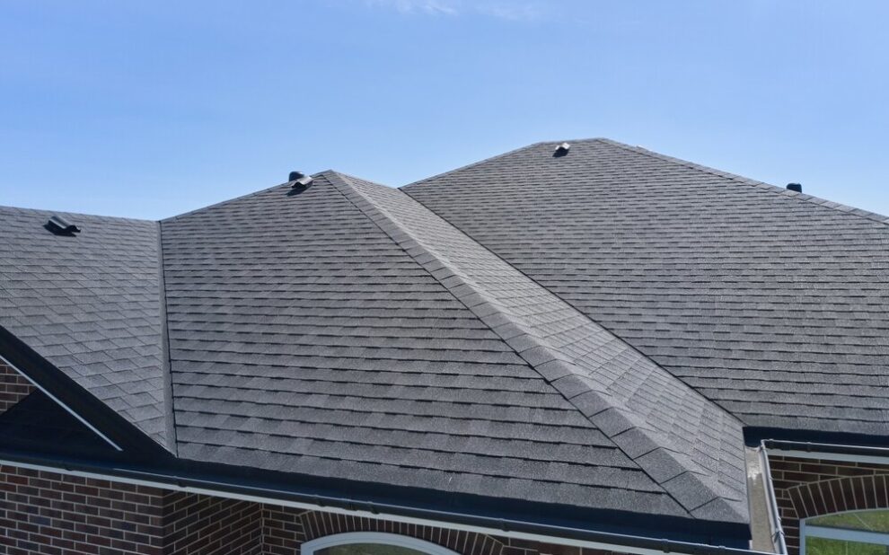 Godfrey Roofing. Roof Of The House Made Of Bitumen Roof Shingles.