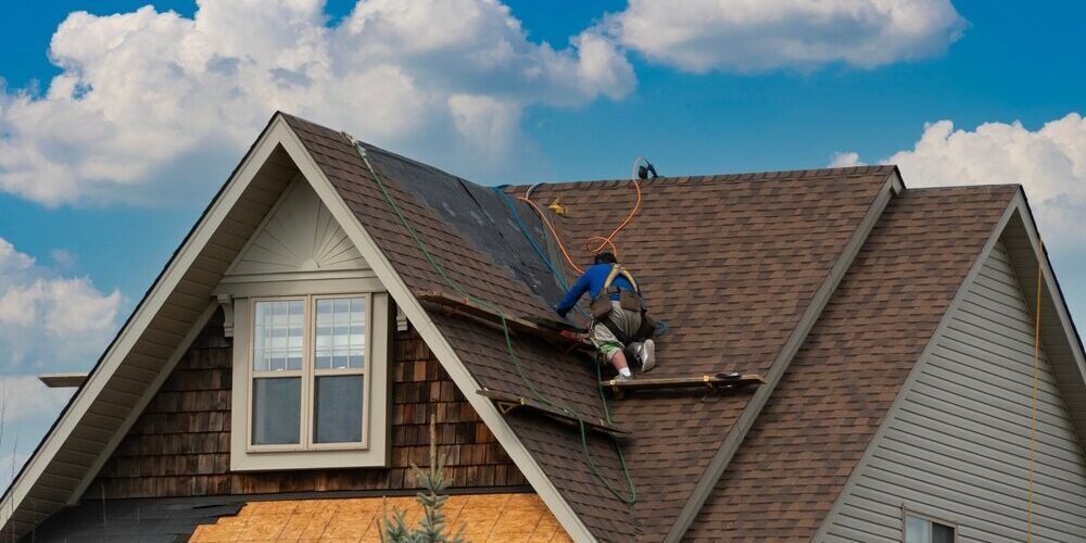 A,Worker,Moves,Along,The,Flooring,To,The,Next,Repair Roof Repair in Ottawa. A Worker Moves Along The roof To Repair roof.