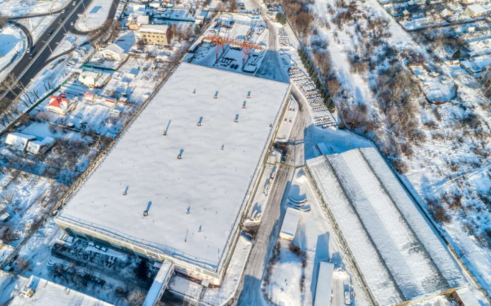 commercial roofing. Large,Warehouse,Hangar,,Industrial,Zone,Of,The,City.,Sunny,Winter