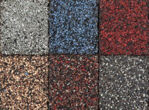 Residential Roofing. Roofing material asphalt shingles samples of various colors, closeup