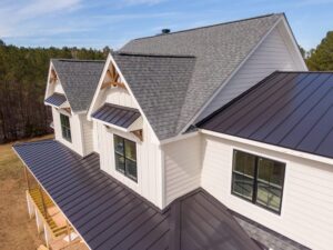 Godfrey Roofing Ottawa’s Premier Roofing Contractor. Sunny Daytime Drone Images of a Custom Home in the Final Stages of Construction. It Features a Roof With Architectural Asphalt Shingles and Standing Seam Accents: Architecture, Industry, Occupations.