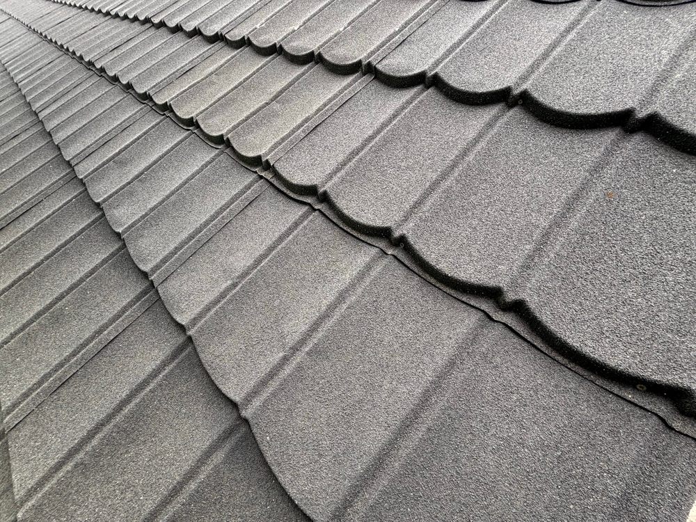 What Are Synthetic Roofing Systems? An intricate pattern formed by the undulating shape of the roof tiles.