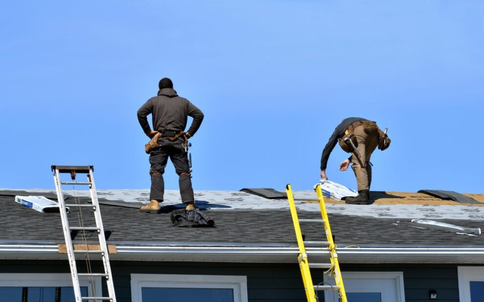 Finding the Best Roofing Contractors Near You: A Guide for Ottawa. Two Men Roofing a House in the Sun in Spring.