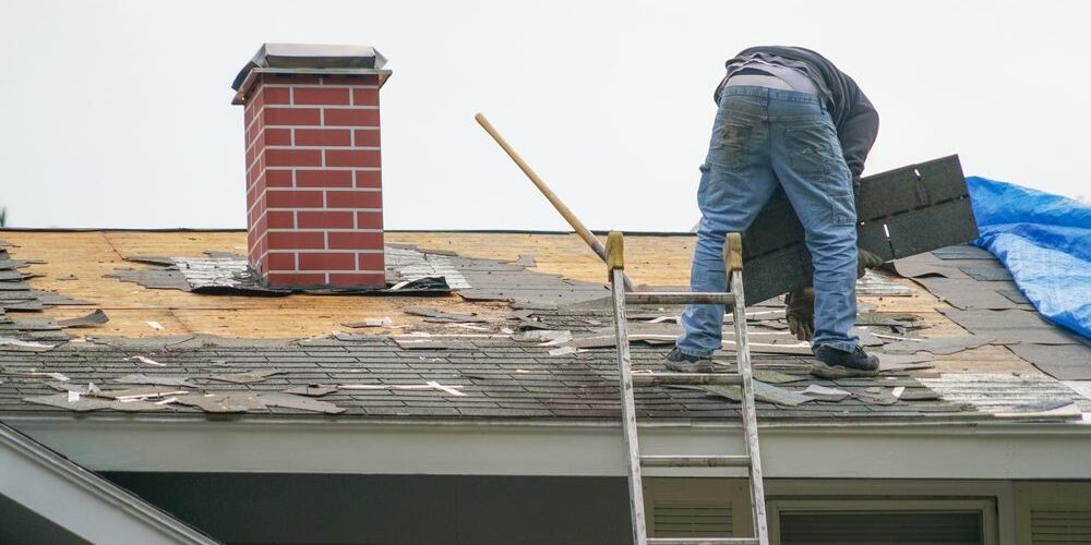 How to Identify When Your Ottawa Roof Needs Repair: A Homeowner’s Guide. worker install new shingle on the roof of the house for roof repair