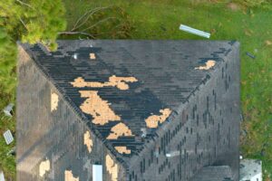 How Timely Roof Repair in Ottawa Protects Your Home & Wallet. Destroyed house roof in residential area. In need of roof repair.