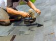 Roof Repair vs. Roof Replacement in Ottawa: How to Know What You Need. During installation of new bitumen shingles, construction roofer used pneumatic air nail gun.