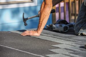 How to Identify When Your Ottawa Roof Needs Repair: A Homeowner’s Guide. handyman working on repair the damaged roof.