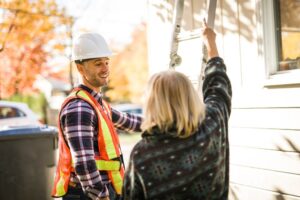 Choose the Best Residential Roofing for Your Ottawa Home Renovation. A man with hard hat talking with customer.